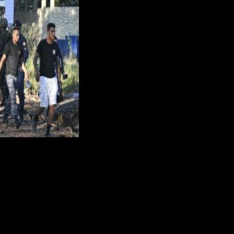 Prison guards walk free after a police operation at the Renovacion I maximum-security prison in Escuintla, Guatemala