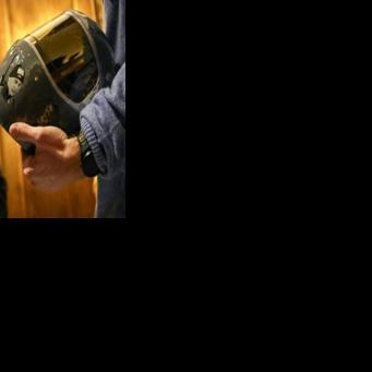 Ukrainian skeleton racer Vladyslav Heraskevych presents to Ukrainian President Volodymyr Zelensky the helmet that led to his disqualification from the 2026 Winter Olympics