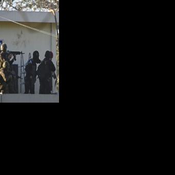 Soldiers take position outside the maximum-security prison in Escuintla, Guatemala