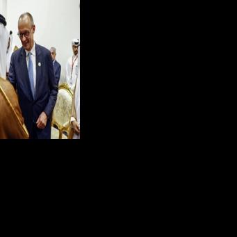 German Chancellor Friedrich Merz meets Qatar's Amir Sheikh Tamim bin Hamad al-Thani in Egypt on October 13, 2025