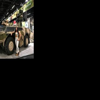 A parked Fennek armoured reconnaissance vehicle served as an attention-grabbing advertisement for the Bundeswehr's recruiting stand -- and a photo backdrop for visitors