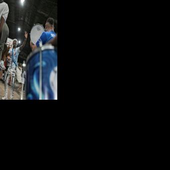 Drum master Americo Teofolo, 37, dreams of performing among the greats, but is deeply proud to parade in a parallel event in Rio de Janeiro's densely-populated north zone