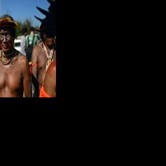 Indigenous people take part in a demonstration in front of the hotel in Rio de Janeiro where an oil blocks auction is taking place
