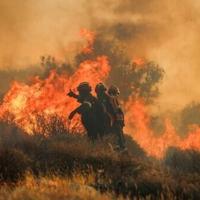 The fire near Athens had already burned five or six houses, one local mayor told ERT public television