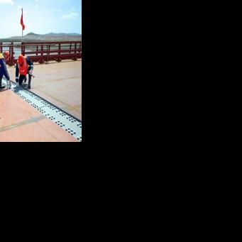 This handout image released by the Russian Transport Ministry shows a ceremony marking the connection of the two sides of the new Russia-North Korea road bridge