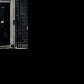 Larry waits to be let in at the door of No. 10 Downing Street, the official residence of Britain's prime minister
