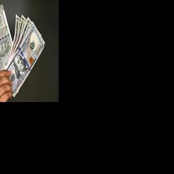 Indian rupee and US dollar notes held by a forex office in New Delhi. The trade deal announced this month has rattled India's powerful farmers' unions, who argue that cheap US imports would throttle local producers