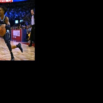 Memphis star Ja Morant drives past Anthony Black in the Grizzlies' NBA victory over the Orlando Magic in London