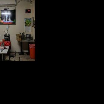 A man in Taiwan watches TV news coverage of the Chinese People's Liberation Army military drills this week, which Taipei called 'highly provocative'