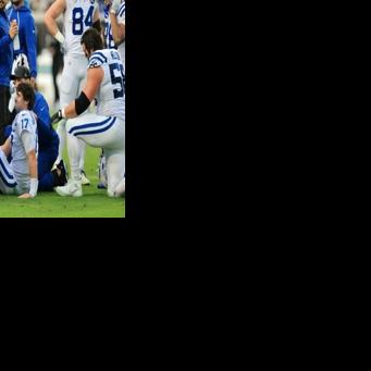 Indianapolis Colts quarterback Daniel Jones is treated by medical staff after suffering an Achilles injury against Jacksonville