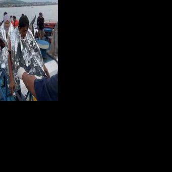 Rescuers assist survivors of the sunken ferry Trisha Kerstin 3 at a port in the Philippines' Basilan province last month