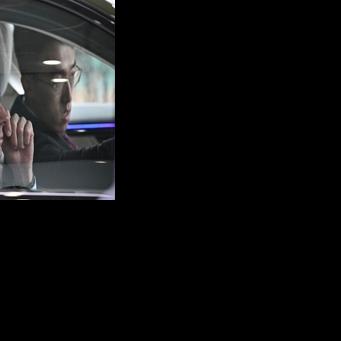 German Chancellor Friedrich Merz (L) takes part in an autonomous driving test of a Mercedes S-Class in Beijing on February 26, 2026.