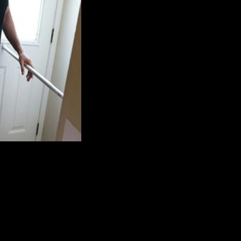 A metal bar braces the door to the home of a Mexican family in Minneapolis that has gone into hiding due to immigration raids in their city