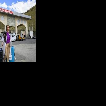 Homa, a 40-year-old Iranian, arrives in Turkey through the Razi-Kapikoy border crossing, north-eastern Turkey on June 18, 2025