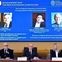 Members of the Swedish Academy of Sciences announce the Nobel economics prize winners, including Peter Howitt (R)