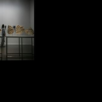 A visitor exploring the Art Basel Qatar exhibition space