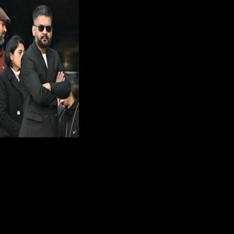 Prime ministerial hopeful Balendra Sha, dressed in a dark suit and sunglasses, lined to vote in Kathmandu