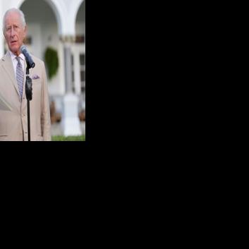 Britain's King Charles III speaks during a garden party at the Government House in Hamilton, Bermuda