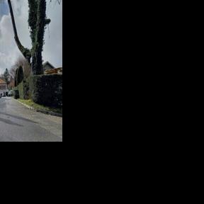 Police officers stand guard at the end of the private street leading to the Omani ambassador's residence