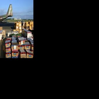 Supplies to be delivered to areas affected by flooding are seen at an Indonesian Air Force base in Sultan Iskandar Muda
