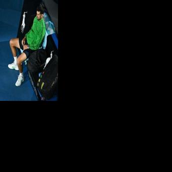 Serbia's Novak Djokovic waits for the presentation ceremony at the Australian Open