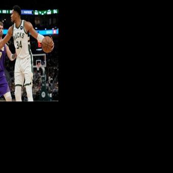 Milwaukee's Giannis Antetokounmpo, right, and Los Angeles Lakers star Luka Doncic, center, were the leaders in the latest fan voting returns announced for the 2026 NBA All-Star tournament by the league