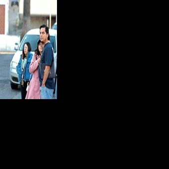 People remain outside after evacuating a hospital building during a 6.5 magnitude earthquake in Puebla, Mexico