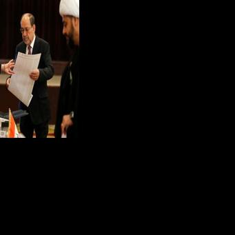 Former Iraqi prime minister Nouri al-Maliki holds the ballot paper at a polling station in Baghdad on November 11, 2025 during parliamentary elections