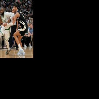 Boston Celtics star Jaylen Brown drives past Ousmane Dieng in the Celtics' NBA victory over the Milwaukee Bucks