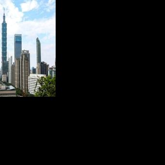 The Taipei 101 building is seen among residential and commercial buildings in Taipei in December 2025. Beijing on Monday announced major live-fire drills around the island