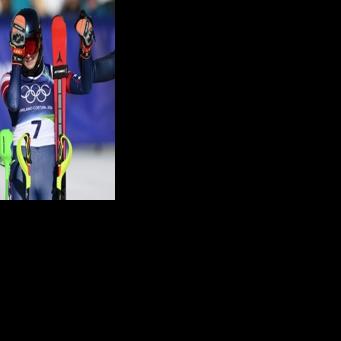 Mikaela Shiffrin (R) and Switzerland's Camille Rast after the women's slalom