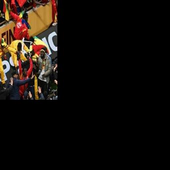 Senegal supporters clash with security forces after a penalty was awarded against their team