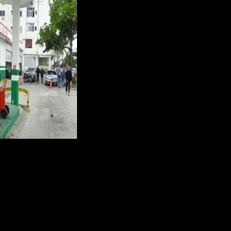 Vehicles wait in line to refuel at a gas station in Havana