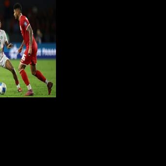 Suriname defender Djavan Anderson (L) in action against Panama in a World Cup qualifier in October