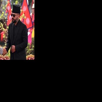 Nepal's newly sworn-in prime minister Balendra Shah (R) shakes hands with president Ram Chandra Paudel (L) during a swearing-in ceremony in Kathmandu on March 27, 2026.