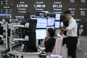 Stocks rise on Wall Street and hover around records
