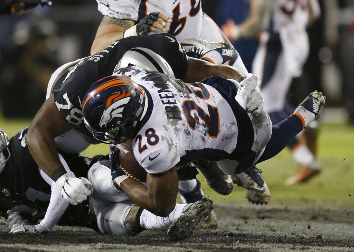Raiders hold Freeman, Broncos in check