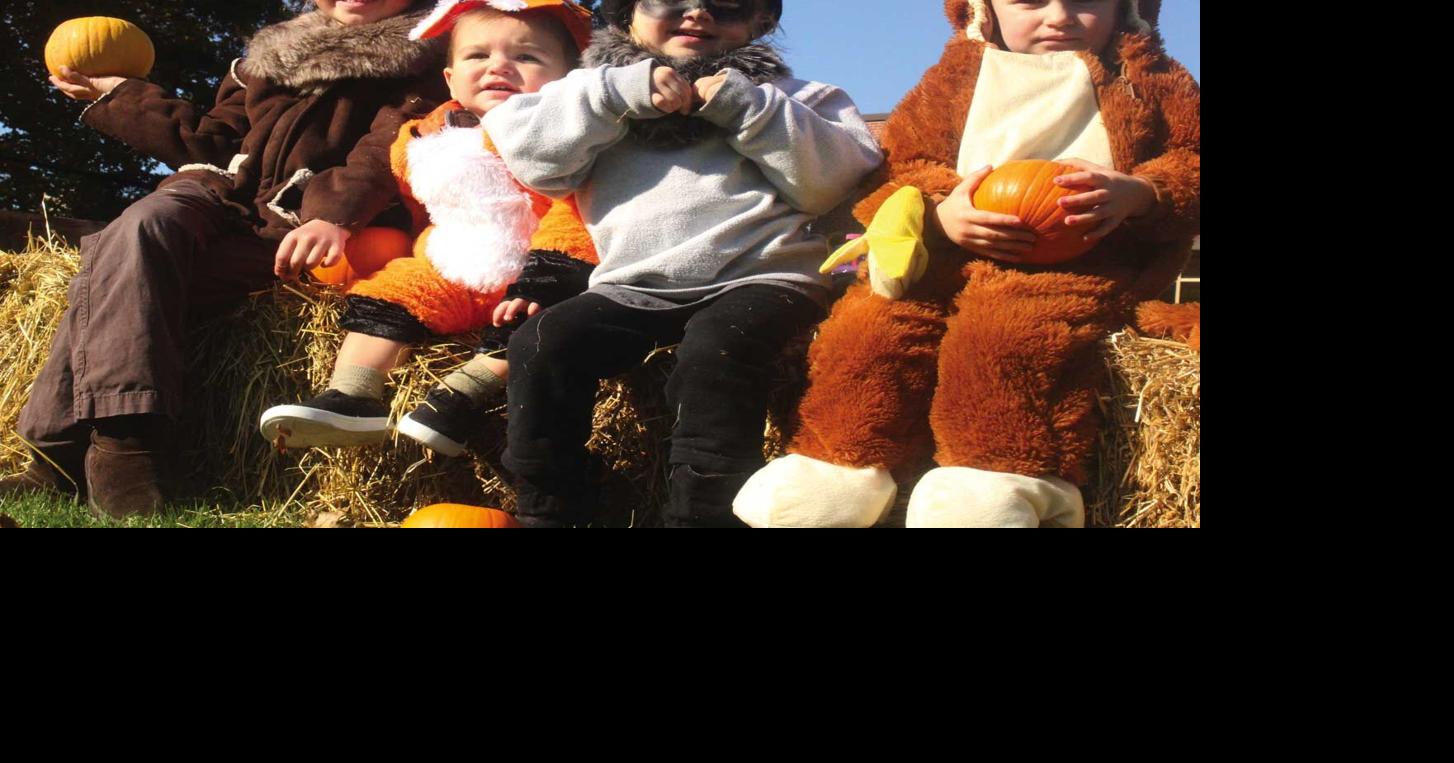 Four trickortreaters took a pause on top of a hay bale at Kiel’s