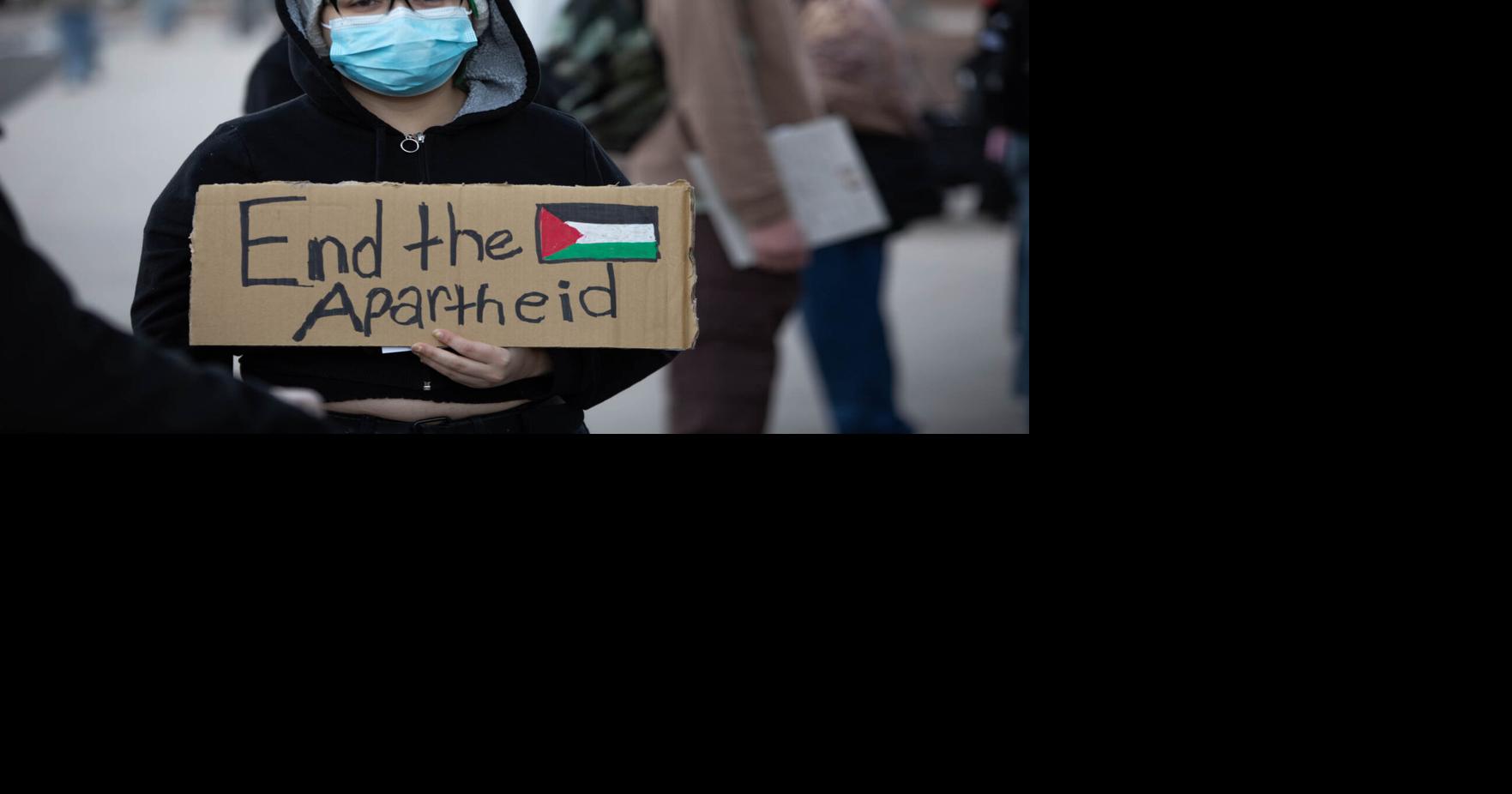 Palestine protesters march downtown for candlelight vigil