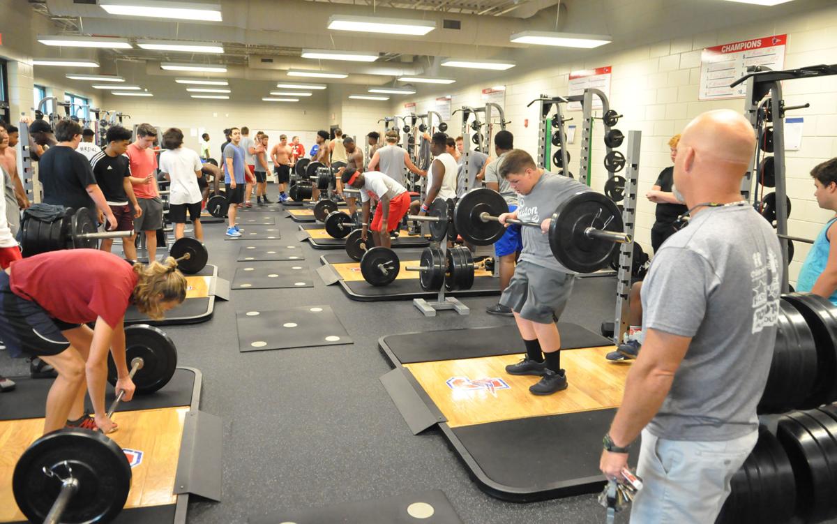 During summer break, football players hit the weight room | Sports | jacksonprogress-argus.com