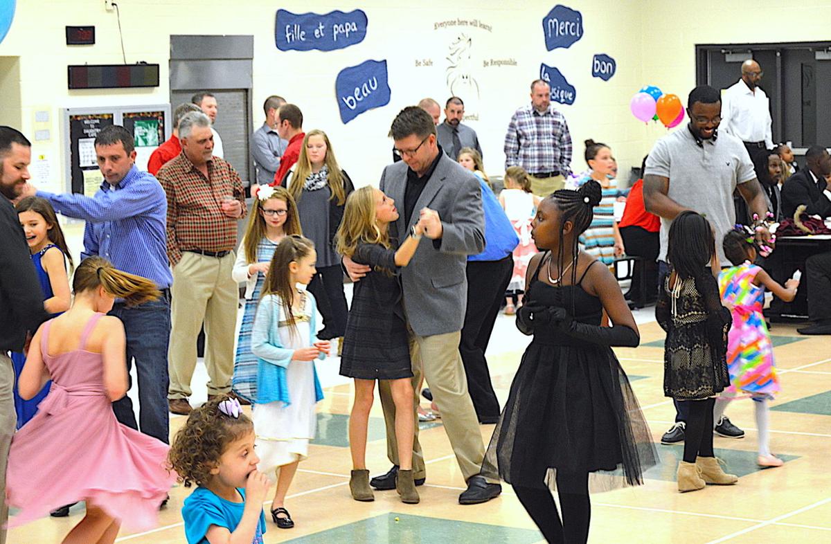 Daughtry Elementary brings Parisian theme to daddydaughter dance