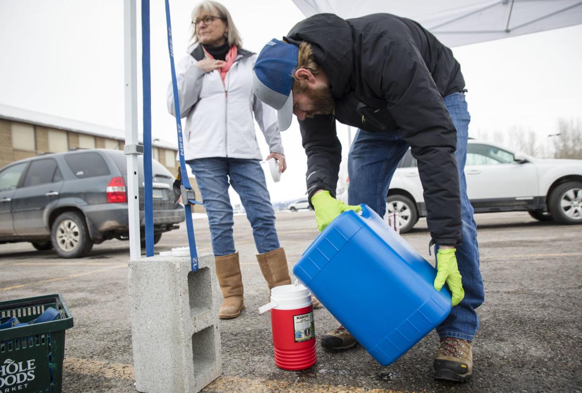 Local businesses make and distribute free hand sanitizer