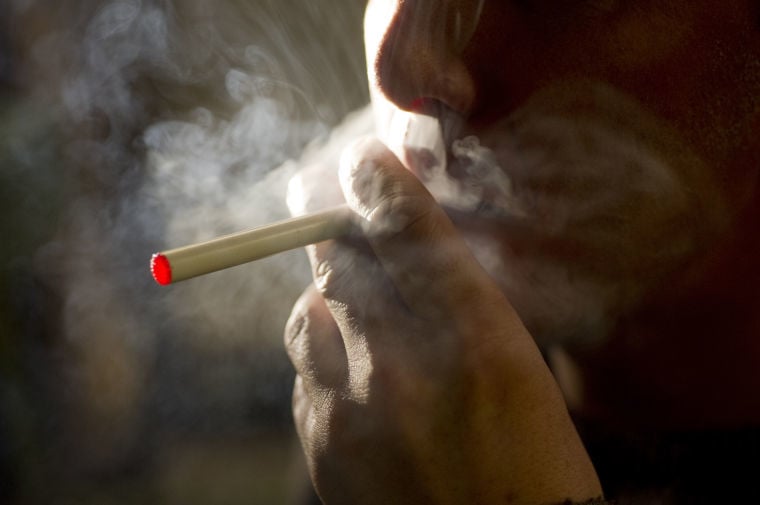 Town council passes public building smoking ordinance tables