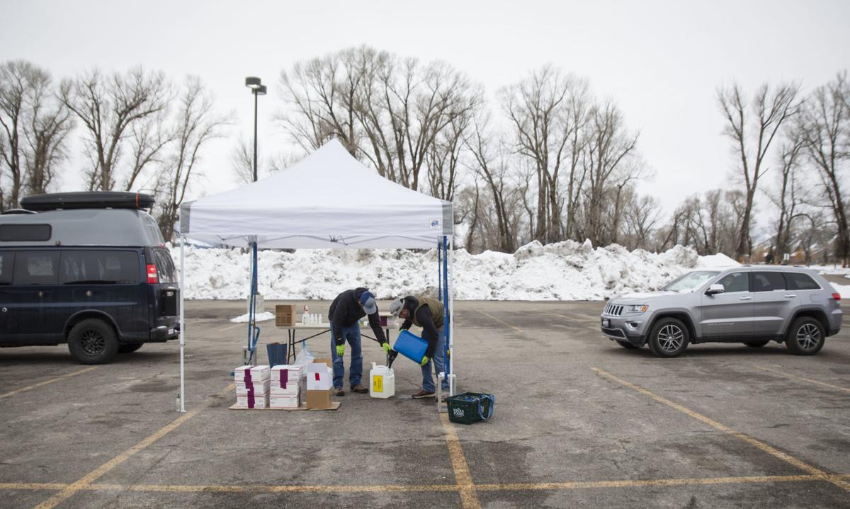 Local businesses make and distribute free hand sanitizer