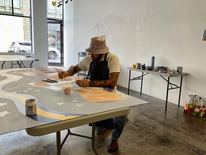 Local youth groups lend a hand on mural representing diversity Local
