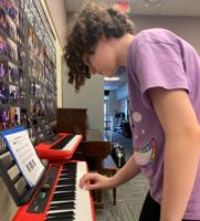 Friends of music donates keyboards to Charles Town Middle School
