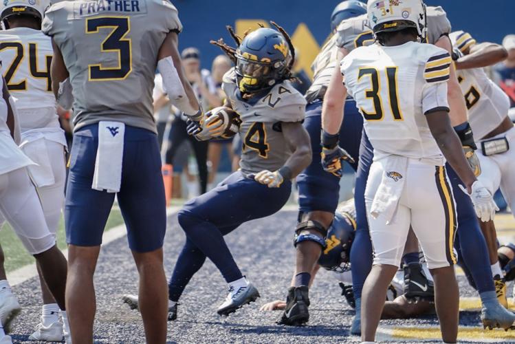 Taking it on the run Mountaineers’ highflying offense anchored by