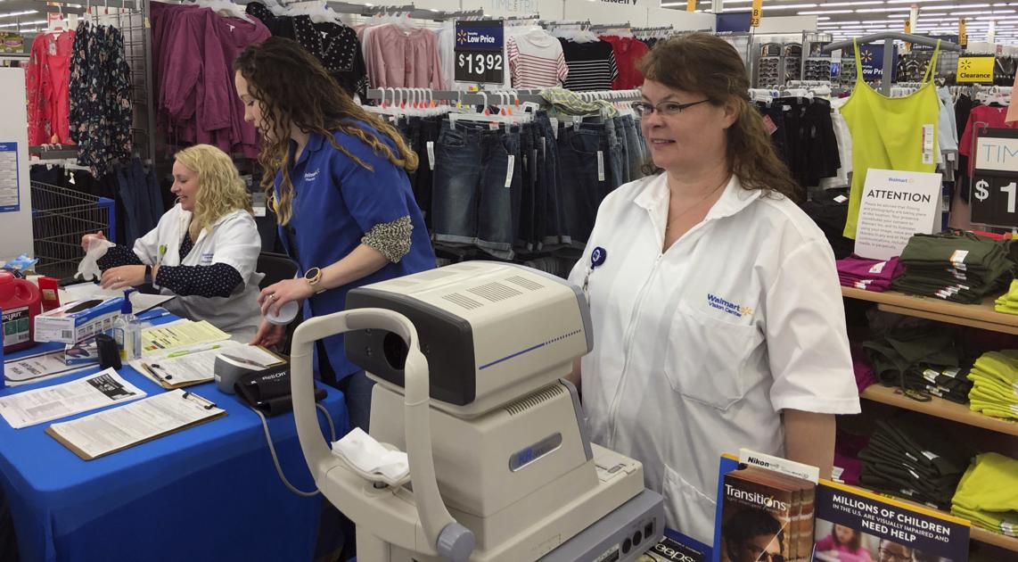 Walmart pharmacy employees give free health screenings to the public