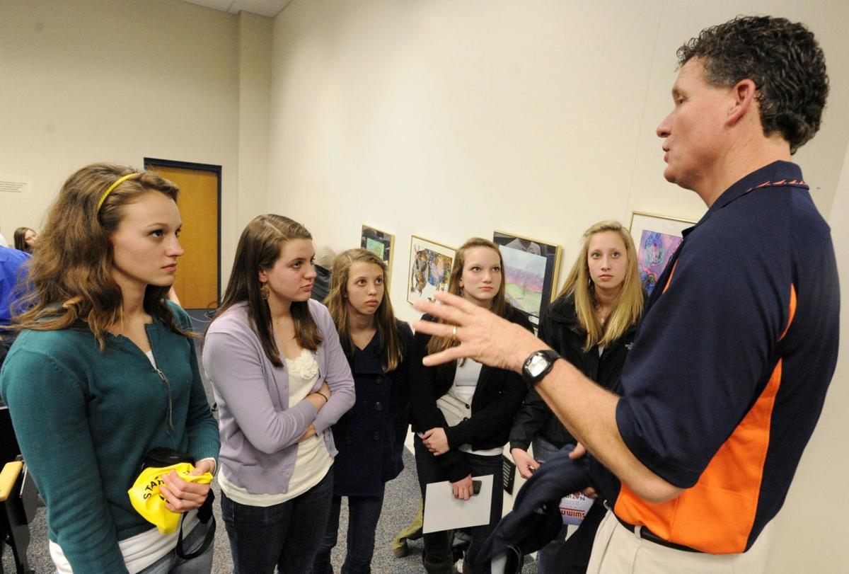Elite swimmers help local kids improve