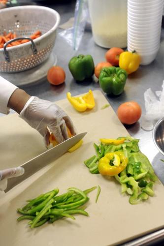 Three young students in cooking class wear aprons enjoyment while taking  selfie photo with mobile phone in kitchen, smiling and laughing, preparing  eggs and fruits, learn fun culinary course together. 7427729 Stock